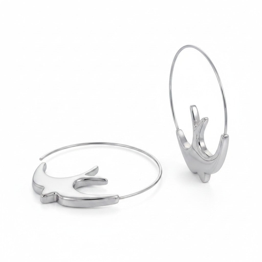 PRO RAY ALYRA sculptural swallow hoop earrings in silver finish. 44mm diameter.