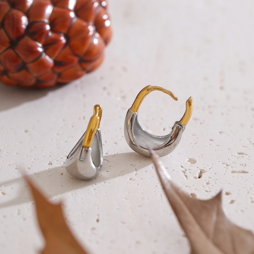 PRO RAY MIREYA sculptural two tone hoop earrings with polished gold and silver finishes, 18mm diameter.