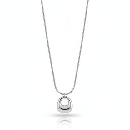 PRO RAY KAREYA gold geometric pendant necklace with smooth sculptural curves on a snake chain.