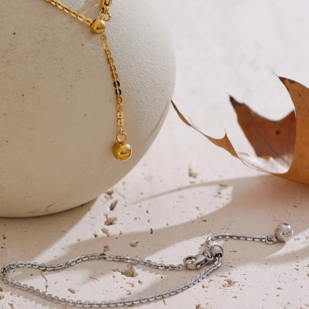 PRO RAY AELORA delicate gold chain bracelet with polished bead accents and adjustable closure. Silver bracelet with bead accents.