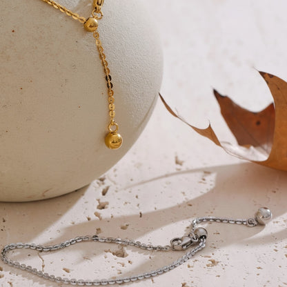 PRO RAY AELORA delicate gold chain bracelet with polished bead accents and adjustable closure. Silver bracelet with bead accents.