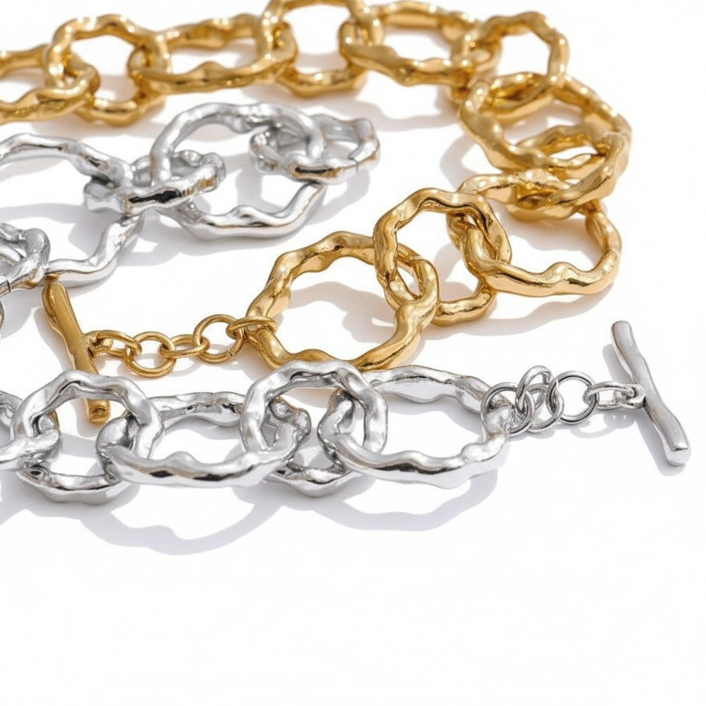 PRO RAY AURELIS bracelet with sculptural organic links in gold and silver tones. Toggle clasp closure.