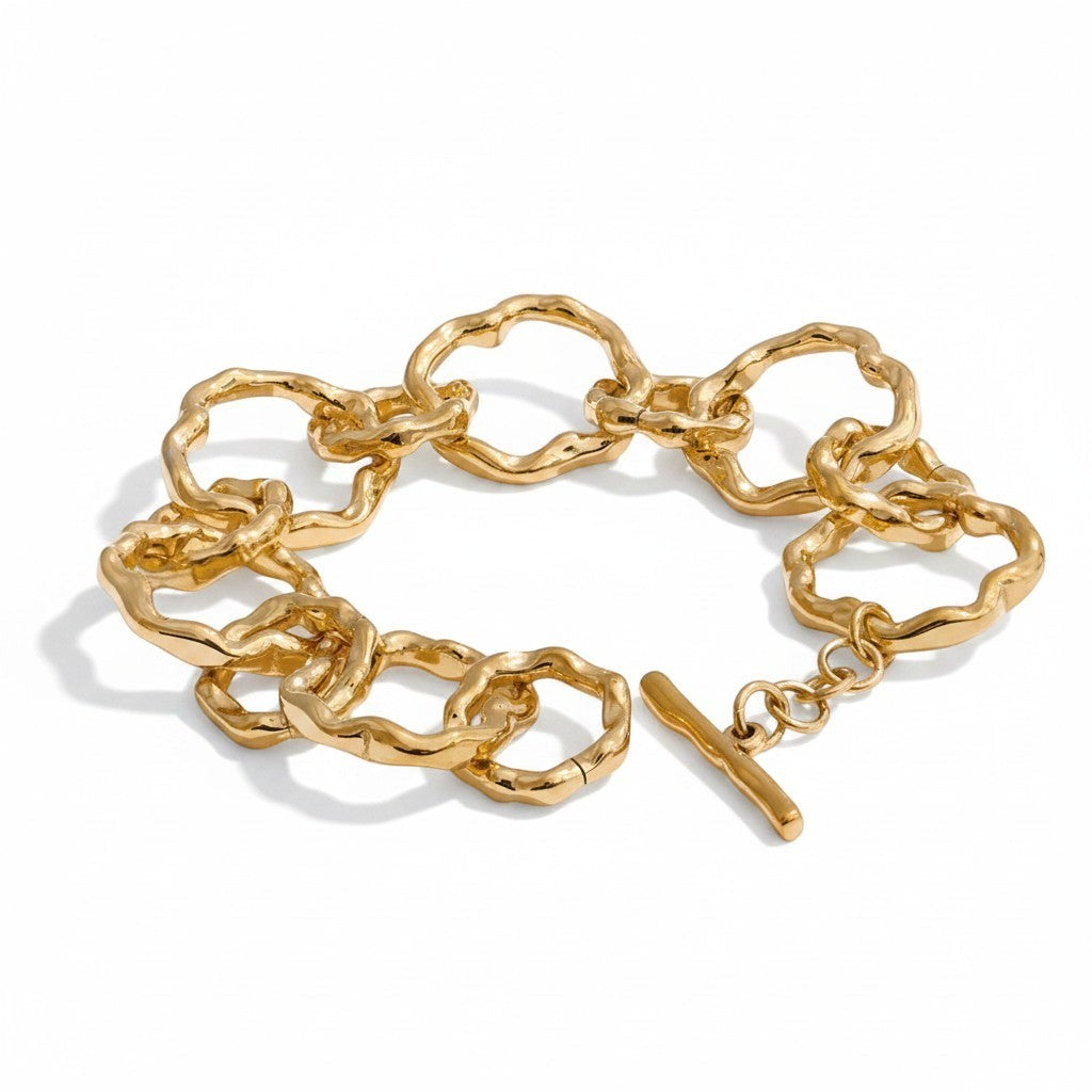 PRO RAY AURELIS bracelet with sculptural organic links and toggle clasp, gold-tone metal.