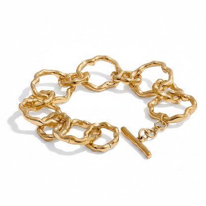 PRO RAY AURELIS bracelet with sculptural organic links and toggle clasp, gold-tone metal.