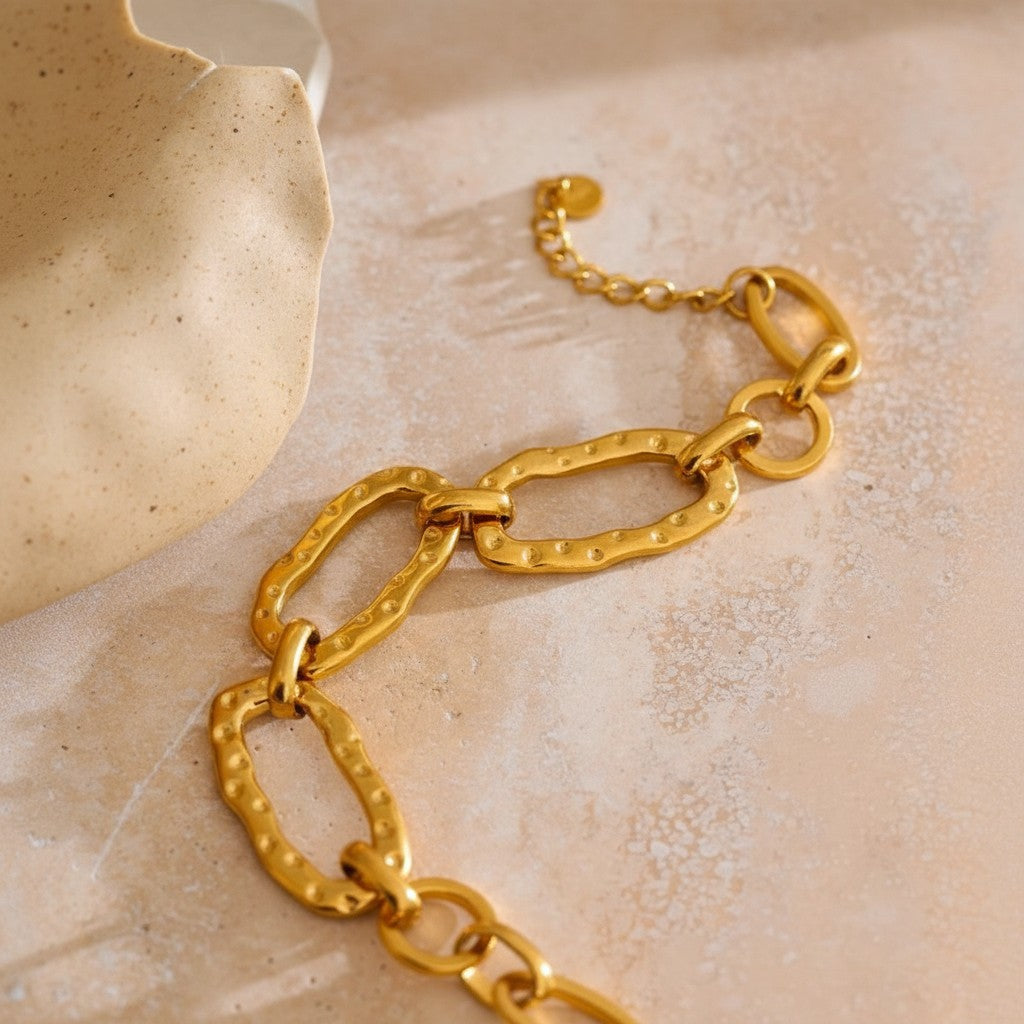 PRO RAY AUREVA gold chain bracelet with textured sculptural oval links. Contemporary statement jewelry.