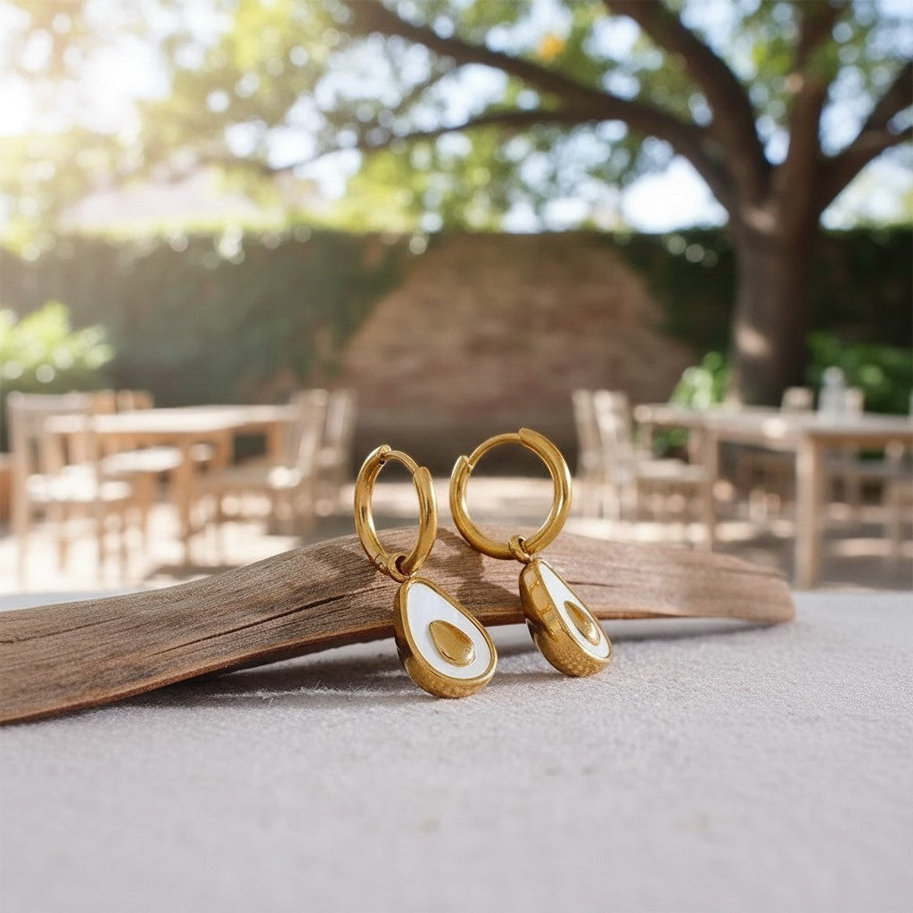 PRO RAY gold hoop earrings with avocado-shaped natural shell drop. Delicate statement jewelry.