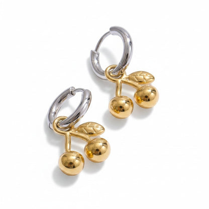 PRO RAY CERISE Hoops: Silver-tone hoops with gold cherry drop charms, featuring two shiny gold cherries and two leaves.