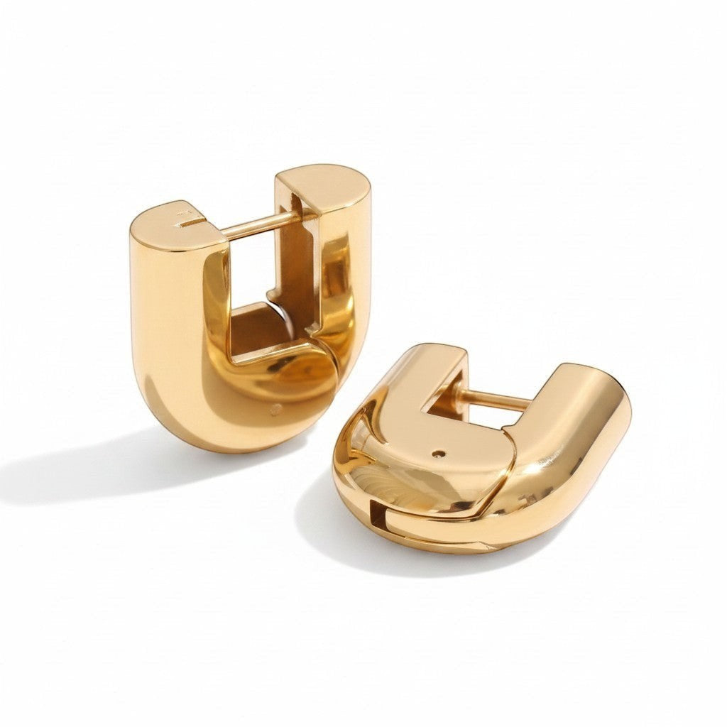 PRO RAY ELARA gold sculptural hoop earrings, 20mm diameter, polished finish, designed for everyday wear.