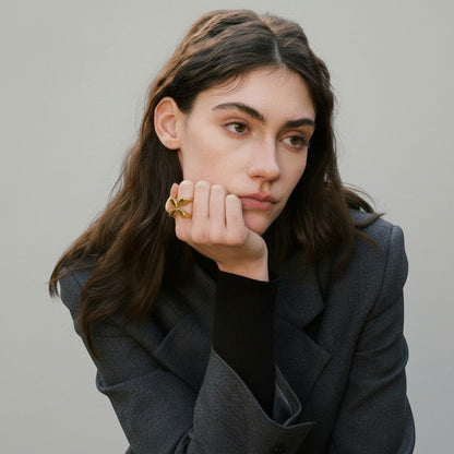 PRO RAY ELIANE open ring with petal shapes in polished gold finish, worn by a model.