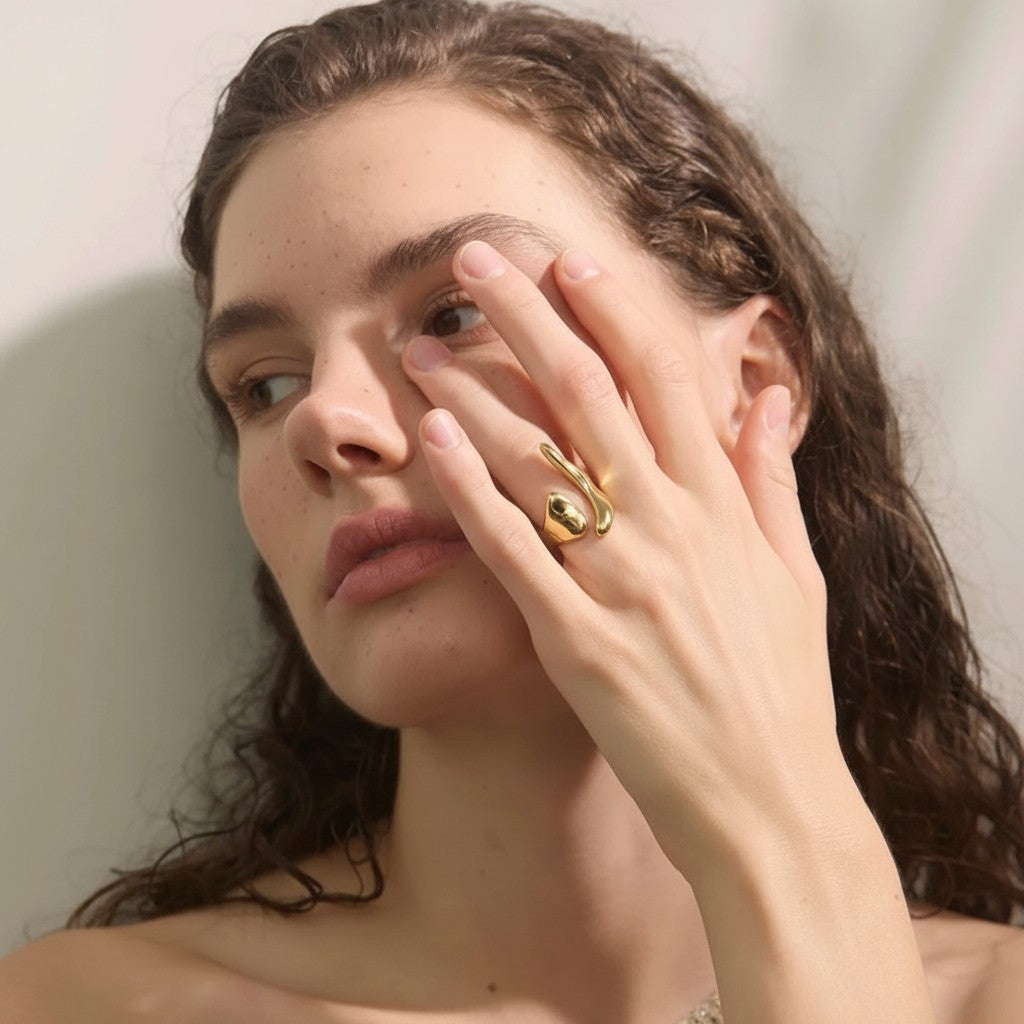 PRO RAY ELISIA open ring with asymmetrical curved lines and fluid modern silhouette in polished gold.