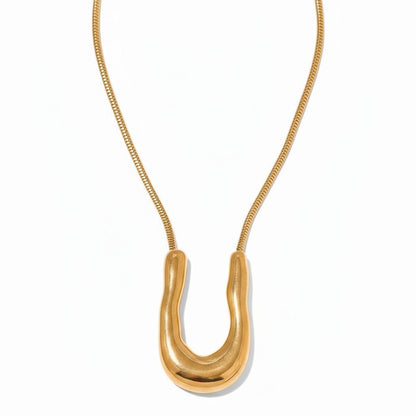 PRO RAY ELORA sculptural gold-tone pendant necklace with fluid organic curves and snake chain.