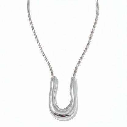 PRO RAY ELORA silver sculptural pendant necklace with organic curves and snake chain. 40mm pendant.