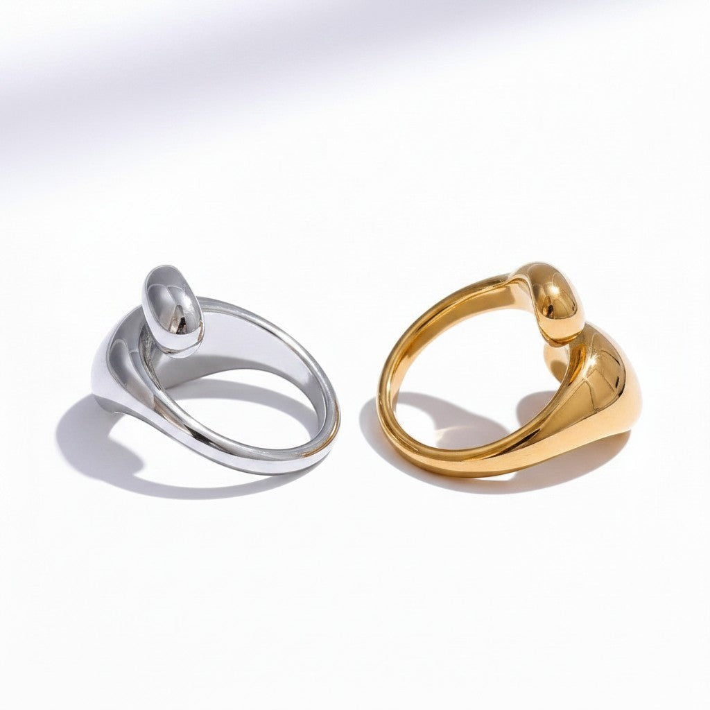 PRO RAY ELORIA open ring in silver and gold, featuring smooth organic curves and a polished, asymmetrical silhouette.