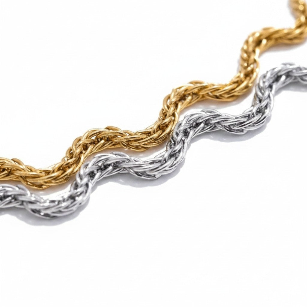 PRO RAY ELVARA bracelet with a fluid wave chain design in gold and silver tones. Minimalist, textured, and adjustable.