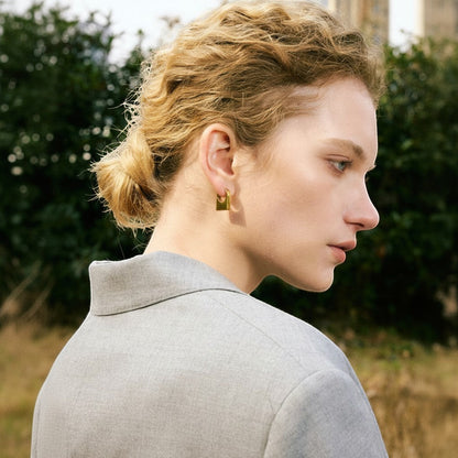 PRO RAY KAIA sculptural rectangular gold hoop earrings with polished finish. Architectural silhouette.