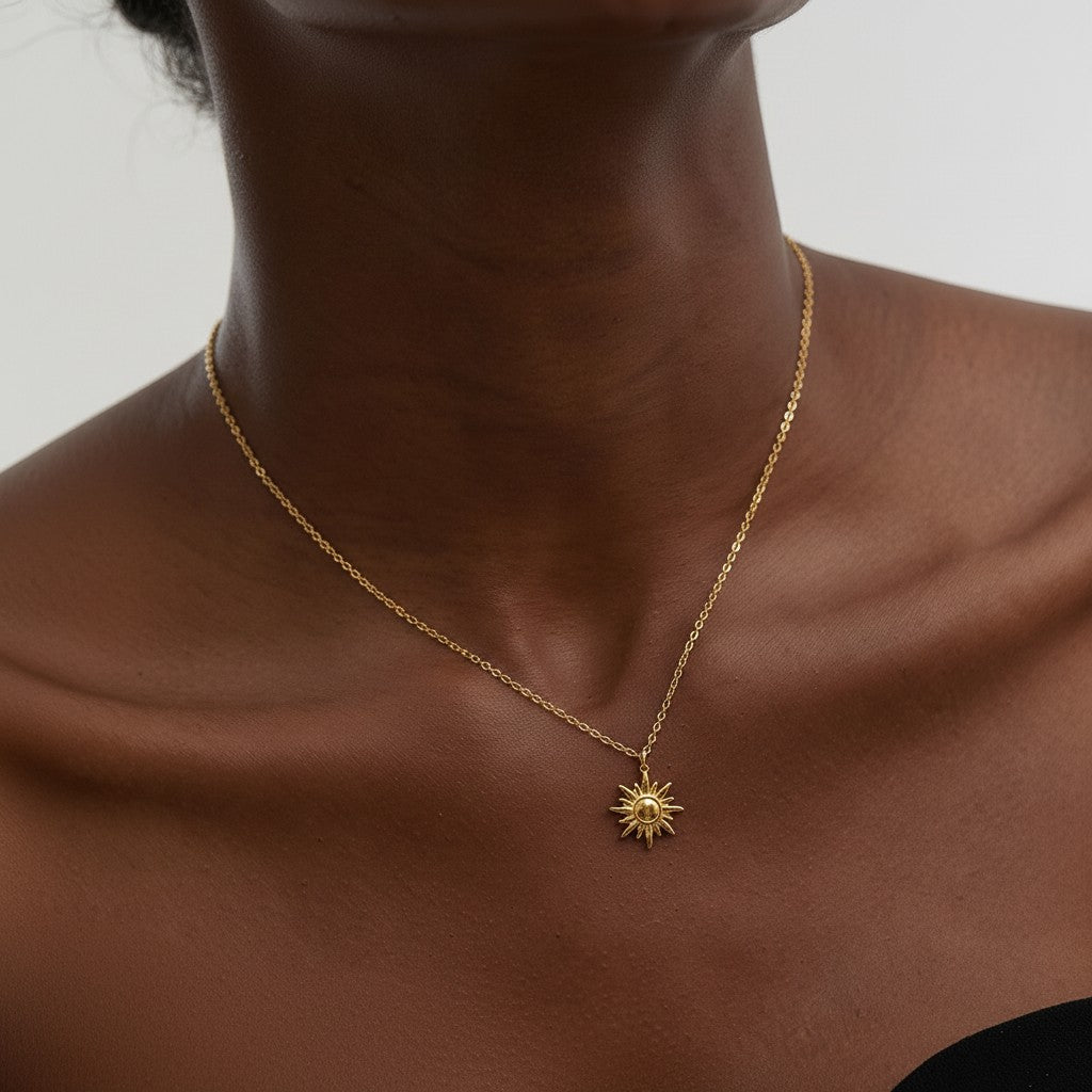PRO RAY LUNEA necklace with a sun-inspired pendant, delicate chain, and sculptural silhouette.