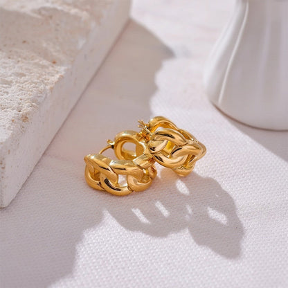 PRO RAY chunky gold chain-inspired hoop earrings with a sculptural design. Modern statement jewelry.