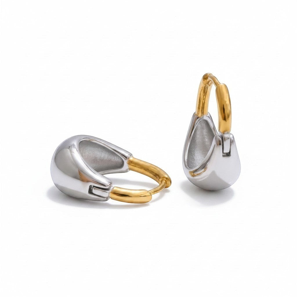 PRO RAY MIREYA sculptural two tone hoop earrings with polished gold and silver finishes.
