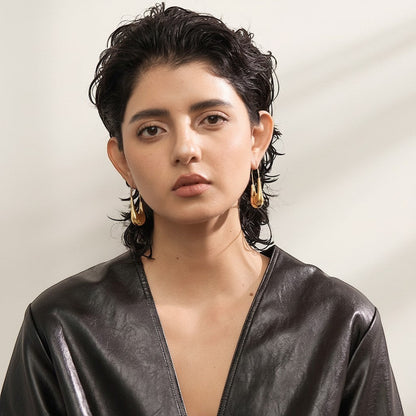 PRO RAY NYRA Hoops sculptural drop earrings in polished gold finish, elongated silhouette, 48mm length.