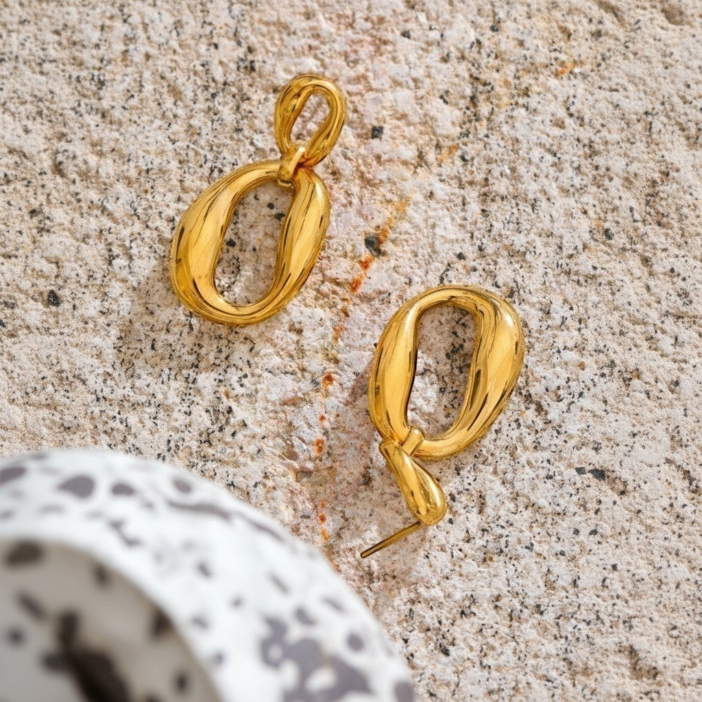 PRO RAY ORINA Drops sculptural open oval drop earrings in polished gold finish.