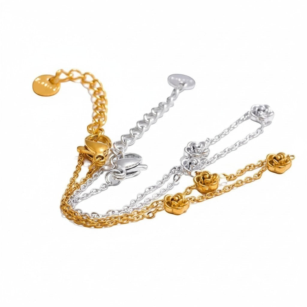 PRO RAY ROVELIA bracelet with delicate floral rose accents in gold and silver tones. Minimalist chain design.