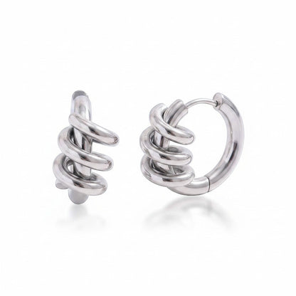 PRO RAY SELENE sculptural spiral hoop earrings in polished silver, 22mm diameter.