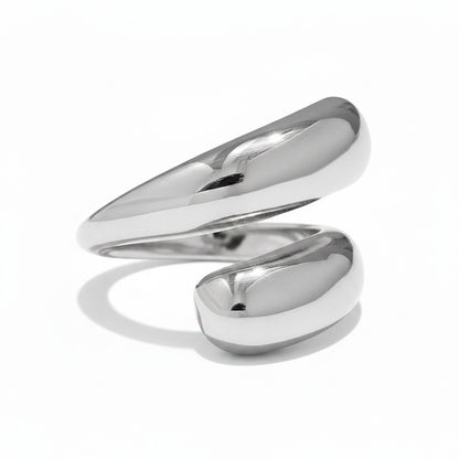PRO RAY SERAVIA sculptural silver ring with flowing curved lines and a smooth polished finish. Modern minimalist open silhouette.