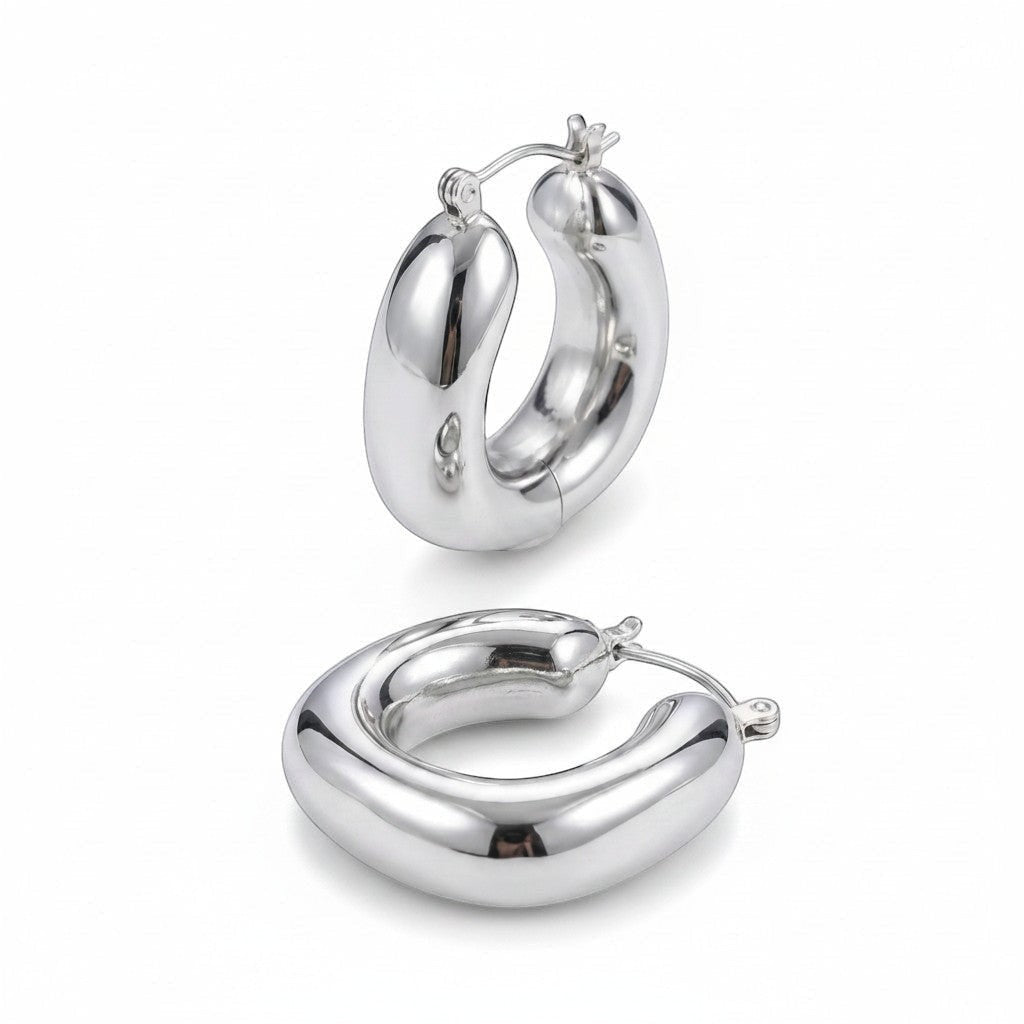 PRO RAY SOREYA sculptural silver-tone metal hoop earrings with a smooth, curved form. Diameter 30mm.