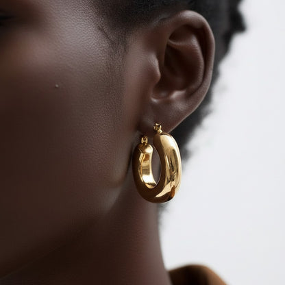 PRO RAY SOREYA sculptural gold-tone hoops with a smooth curved form, 30mm diameter.