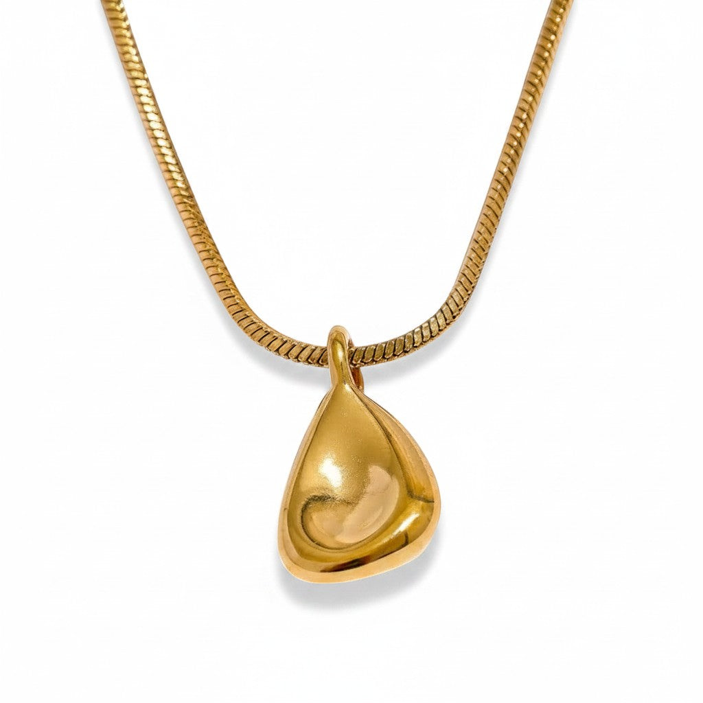 PRO RAY TELYA necklace with sculptural gold pendant and snake chain. Pendant has soft flowing curves.