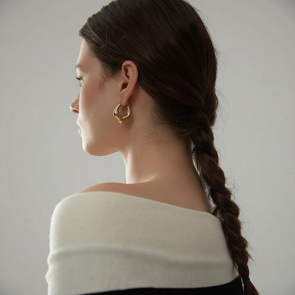 PRO RAY VIONA sculptural gold hoop earrings with a fluid organic shape and polished finish.
