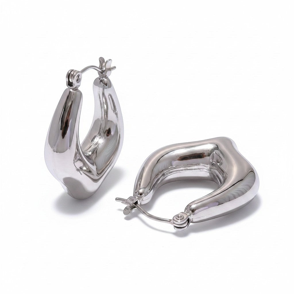 PRO RAY VIONA sculptural silver hoop earrings with a fluid organic shape and polished finish, 30mm diameter.