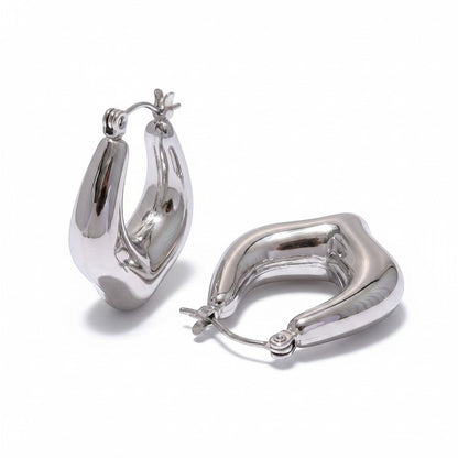 PRO RAY VIONA sculptural silver hoop earrings with a fluid organic shape and polished finish, 30mm diameter.