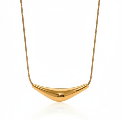 PRO RAY VIRA necklace with a fluid sculptural gold pendant on a snake chain. Perfect for day or evening wear.