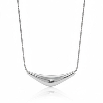 PRO RAY VIRA necklace with a fluid sculptural silver pendant on a snake chain. Modern statement jewelry.