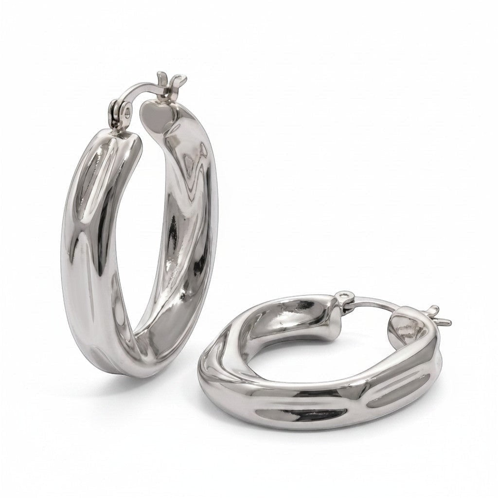 PRO RAY ZARIA silver-tone twisted hoop earrings with a sculptural silhouette, 31mm diameter.