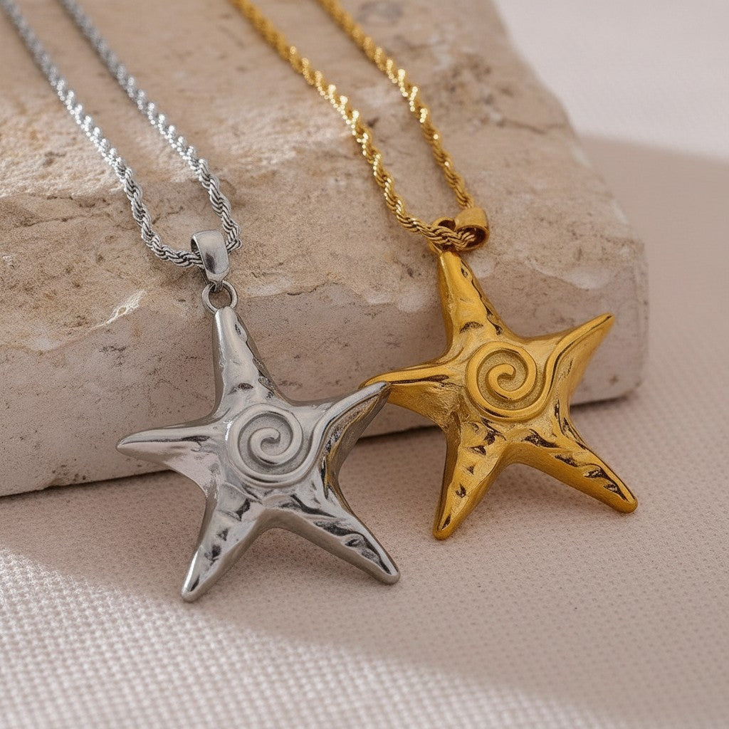 PRO RAY ZOREYA star pendant necklace in gold and silver tones with sculptural detailing.