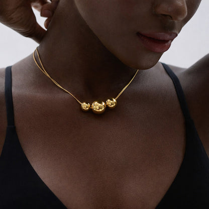 PRO RAY NOVA gold necklace close up on model minimalist bead necklace
