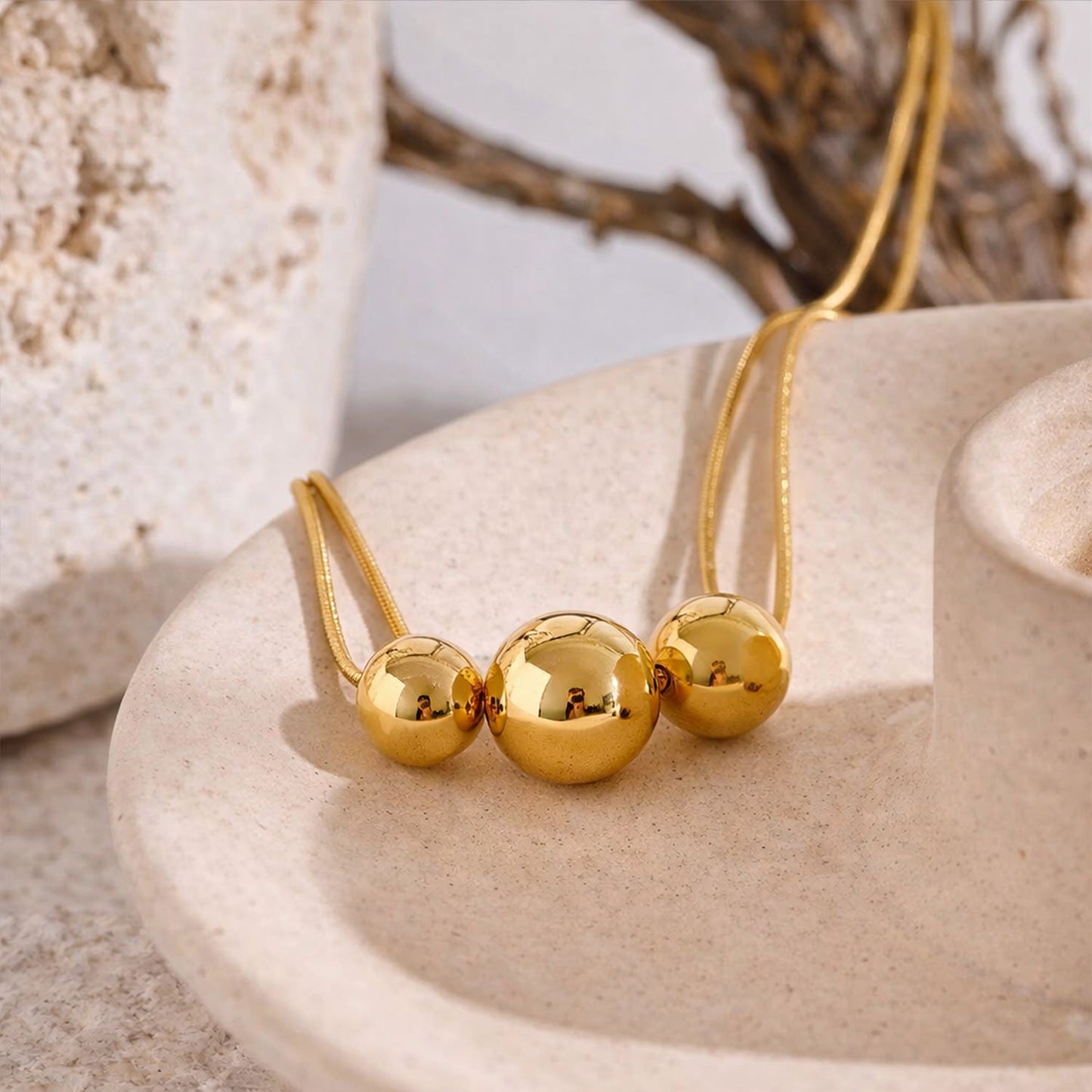PRO RAY NOVA gold necklace lifestyle studio shot minimalist bead necklace